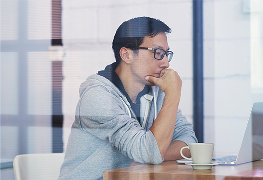 Image Of a man With His Laptop
